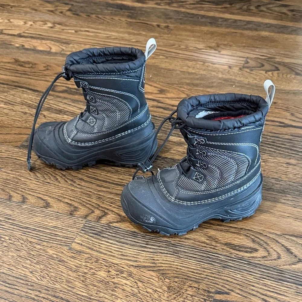 The North Face Kids Black Snow Boots with Red Lining